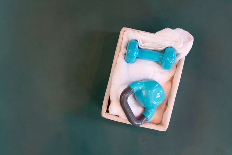 blue kettlebell and dumbbell in a box