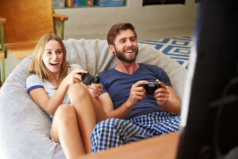 couple playing games on bean bag