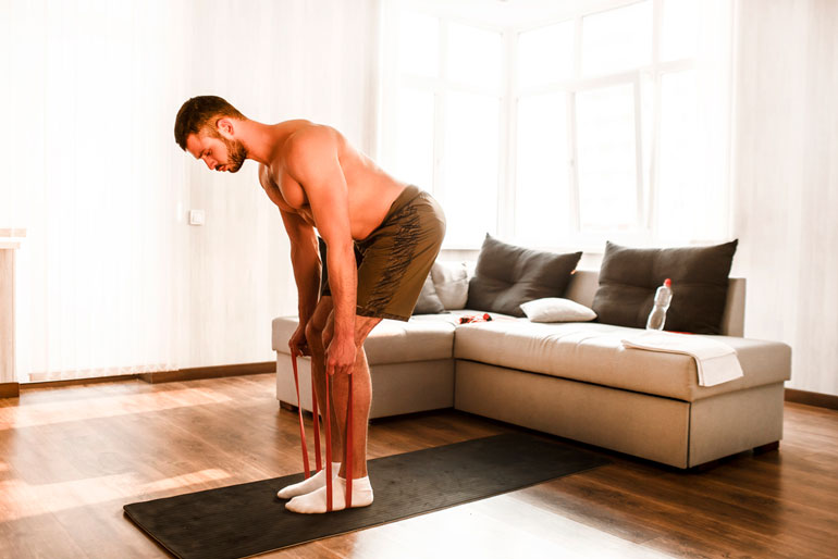 man doing sport workout in room
